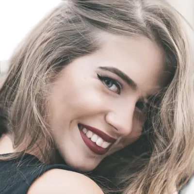 Close-up of a woman’s face with a friendly smile