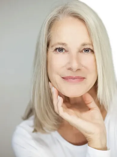 Older woman portrait with light makeup and a well-groomed appearance