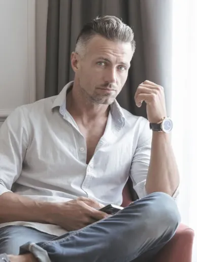 Middle-aged man sitting casually showing a relaxed and natural appearance