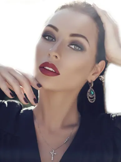 Young woman with natural makeup showing face and décolleté