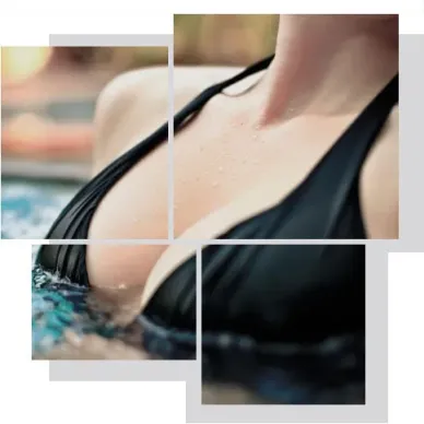 Close-up of female chest area by the pool showing natural contours