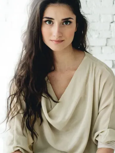 Young woman with a natural look resting in a quiet moment
